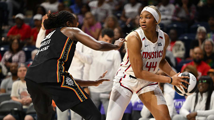 Jun 8, 2025; Washington, District of Columbia, USA; Washington Mystics forward Kiki Iriafen (44) looks to drive past Connecticut Sun center Tina Charles (31) during the second quarter at CareFirst Arena. Mandatory Credit: Rafael Suanes-Imagn Images Jun 8, 2025; Washington, District of Columbia, USA; Washington Mystics forward Kiki Iriafen (44) looks to drive past Connecticut Sun center Tina Charles (31) during the second quarter at CareFirst Arena. Mandatory Credit: Rafael Suanes-Imagn Images