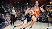 Sep 22, 2024; Uncasville, Connecticut, USA; Indiana Fever guard Caitlin Clark (22) dribbles the ball defended by Connecticut Sun guard Marina Mabrey (4).