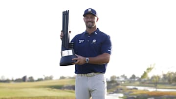 Bryson DeChambeau celebrates with the trophy after winning LIV Golf Korea at Jack Nicklaus Golf Club