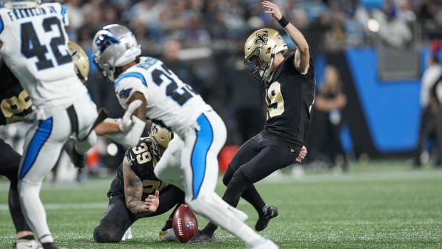 New Orleans Saints place kicker Blake Grupe (19) kicks an extra point against the Carolina Panthers 