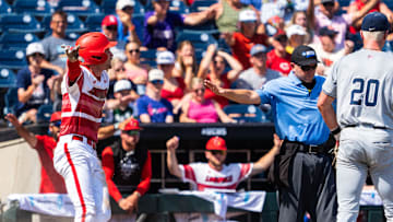 Jun 15, 2025; Omaha, Neb, USA; Louisville Cardinals designated hitter Garret Pike (2) celebrates after scoring on an error against the Arizona Wildcats during the eighth inning at Charles Schwab Field. Mandatory Credit: Dylan Widger-Imagn Images