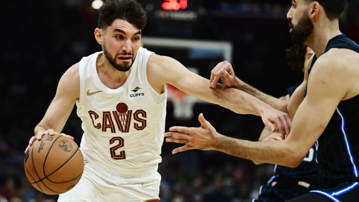 Oct 12, 2023; Cleveland, Ohio, USA; Cleveland Cavaliers guard Ty Jerome (2) drives to the basket against Orlando Magic center Goga Bitadze (35) during the second half at Rocket Mortgage FieldHouse. Mandatory Credit: Ken Blaze-USA TODAY Sports