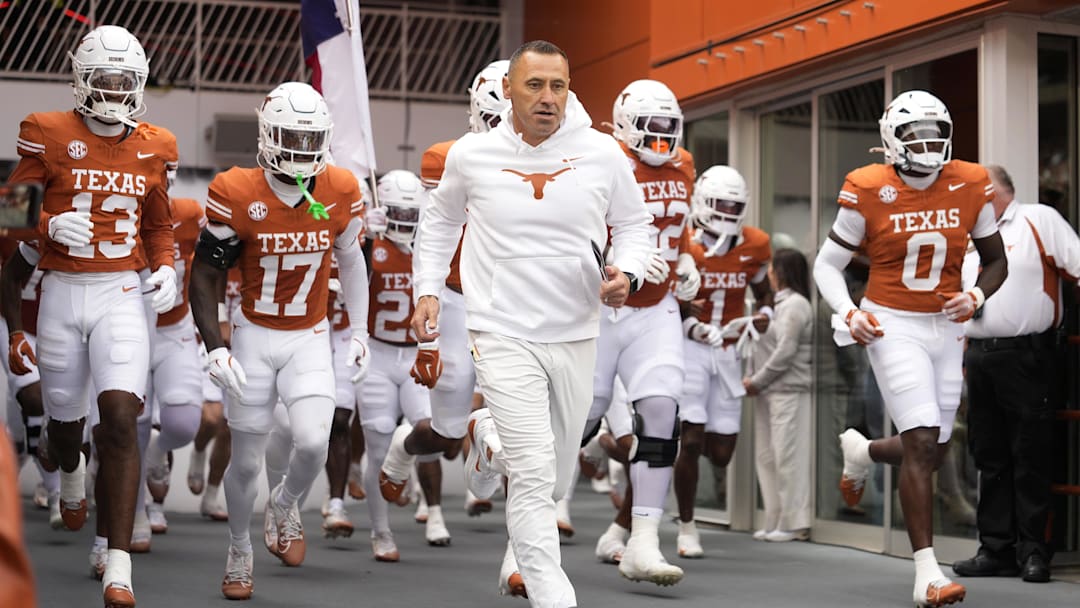 Nov 1, 2025; Austin, Texas, USA; Texas Longhorns head coach Steve Sarkisian leads his team on to the field before a game against the Vanderbilt Commodores at Darrell K Royal-Texas Memorial Stadium. Mandatory Credit: Scott Wachter-Imagn Images