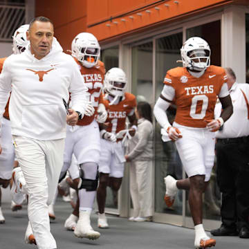 Nov 1, 2025; Austin, Texas, USA; Texas Longhorns head coach Steve Sarkisian leads his team on to the field before a game against the Vanderbilt Commodores at Darrell K Royal-Texas Memorial Stadium. Mandatory Credit: Scott Wachter-Imagn Images