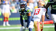 Sep 7, 2025; Seattle, Washington, USA; Seattle Seahawks linebacker Derick Hall (58) and Seattle Seahawks safety Julian Love (20) celebrate after a play during the first half against San Francisco 49ers at Lumen Field.
