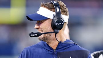 Aug 22, 2025; Arlington, Texas, USA; Dallas Cowboys head coach Brian Schottenheimer smiles during the first quarter against the Atlanta Falcons at AT&T Stadium. Mandatory Credit: Andrew Dieb-Imagn Images