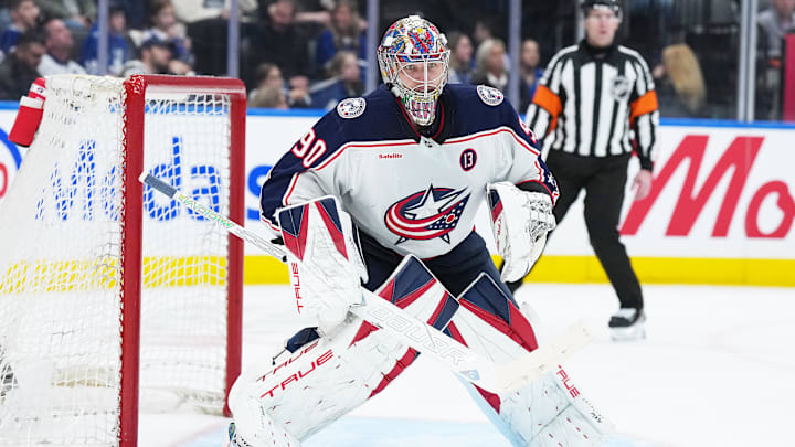 Apr 5, 2025; Toronto, Ontario, CAN; Columbus Blue Jackets goaltender Elvis Merzlikins (90) follows the play against the Toronto Maple Leafs during the third period at Scotiabank Arena. Mandatory Credit: Nick Turchiaro-Imagn Images