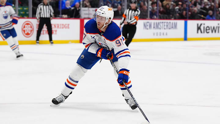Nov 30, 2024; Denver, Colorado, USA; Edmonton Oilers center Connor McDavid (97) prepares to shoot the puck in the first period against the Colorado Avalanche at Ball Arena. Mandatory Credit: Ron Chenoy-Imagn Images