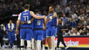 Apr 4, 2024; Dallas, Texas, USA; Dallas Mavericks guard Luka Doncic (77) and guard Kyrie Irving (11) and forward P.J. Washington (25) walk off the court during the first half at the American Airlines Center. Mandatory Credit: Jerome Miron-USA TODAY Sports