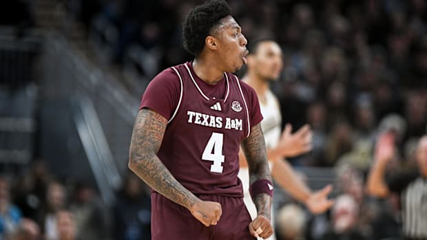 Texas A&M Aggies guard Wade Taylor IV celebrates after forcing a turnover against Purdue.