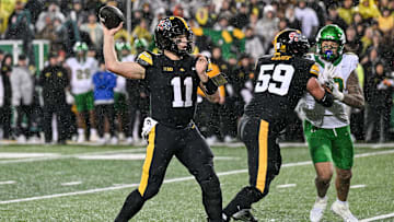 Nov 8, 2025; Iowa City, Iowa, USA; Iowa Hawkeyes quarterback Mark Gronowski (11) throws a pass during the fourth quarter against the Oregon Ducks at Kinnick Stadium. Mandatory Credit: Jeffrey Becker-Imagn Images
