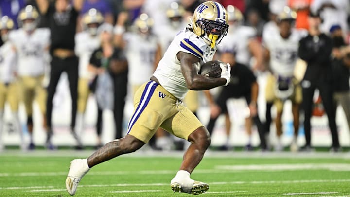 Oct 4, 2025; College Park, Maryland, USA;  Washington Huskies running back Jonah Coleman (1) carries the ball against the Maryland Terrapins at SECU Stadium. Mandatory Credit: Jamie Sabau-Imagn Images