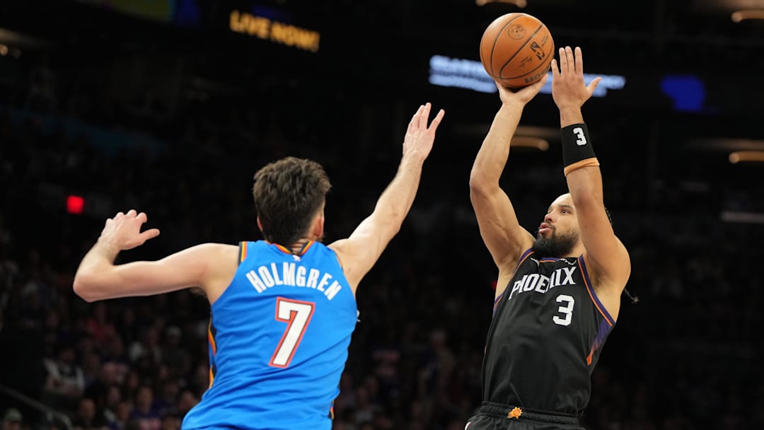 Apr 25, 2026; Phoenix, Arizona, USA; Phoenix Suns forward Dillon Brooks (3) shoots over Oklahoma City Thunder center Chet Holmgren (7) in the second half during game three of the first round of the 2026 NBA Playoffs at Mortgage Matchup Center. Mandatory Credit: Rick Scuteri-Imagn Images