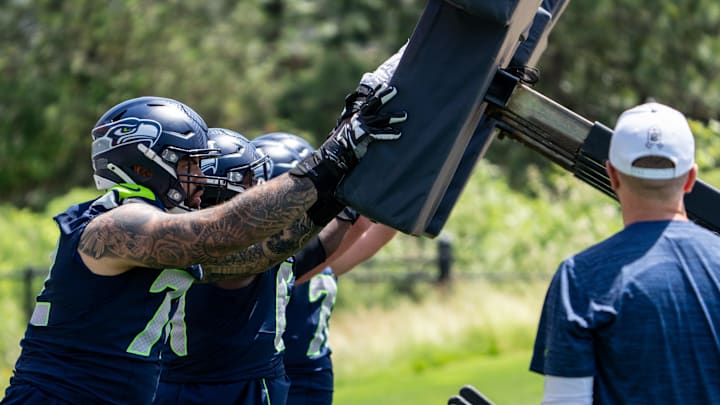 Jun 11, 2025; Renton, WA, USA; Seattle Seahawks offensive linemen, including Abraham Lucas (72), take part in drills during mini-camp at Virginia Mason Athletic Center.