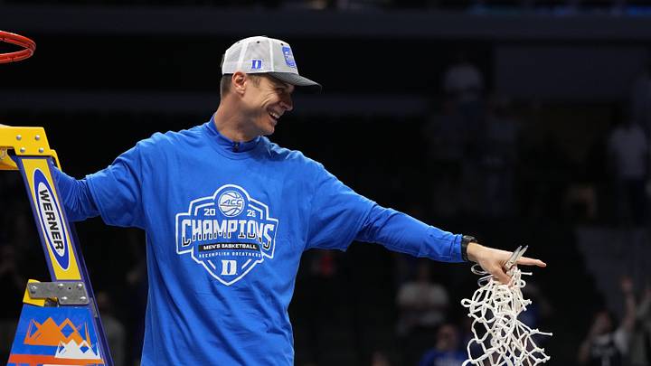 Mar 14, 2026; Charlotte, NC, USA; Duke Blue Devils head coach Jon Scheyer cuts down the net after defeating the Virginia Cavaliers in the men's ACC Conference Tournament Championship at Spectrum Center. Mandatory Credit: Bob Donnan-Imagn Images