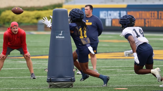 West Virginia University receiver Brandon Rehmann going through drills in fall camp. 