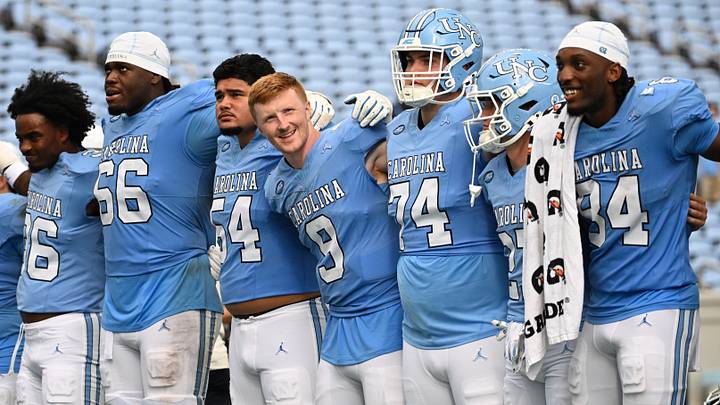 Sep 12, 2026; Chapel Hill, North Carolina, USA; North Carolina Tar Heels players including quarterback Billy Edwards Jr. (9) (center) together after the game at Kenan Stadium. Mandatory Credit: Bob Donnan-Imagn Images