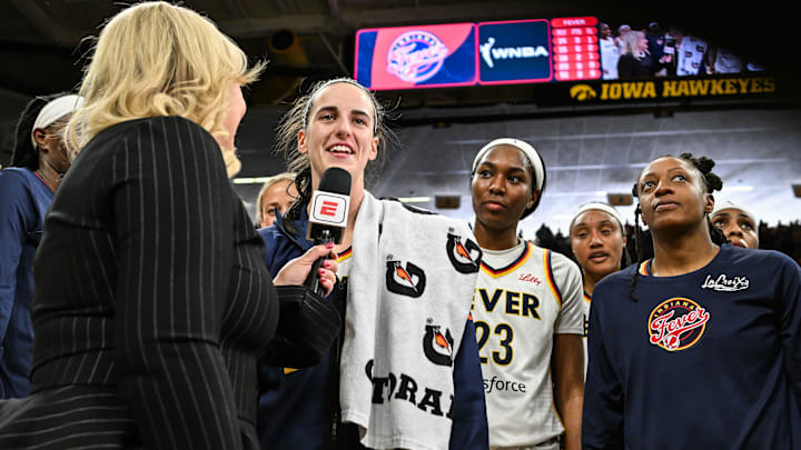 Indiana Fever guards Caitlin Clark (22), Bree Hall (23) and Kelsey Mitchell (0) at Carver-Haweye Arena.