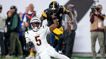 Cincinnati Bengals wide receiver Tee Higgins (5) slides short of the end zone to run time off the clock late in the fourth quarter of the NFL Week 7 game between the Cincinnati Bengals and the Pittsburgh Steelers at Paycor Stadium in downtown Cincinnati on Thursday, Oct. 16, 2025. The Bengals won, 33-31.