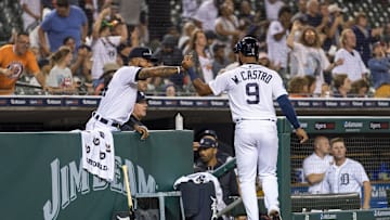 Jun 13, 2022; Detroit, Michigan, USA; Detroit Tigers center fielder Willi Castro (9) celebrates with center fielder Derek Hill (left) after scoring a run during the sixth inning against the Chicago White Sox at Comerica Park. Mandatory Credit: Raj Mehta-Imagn Images