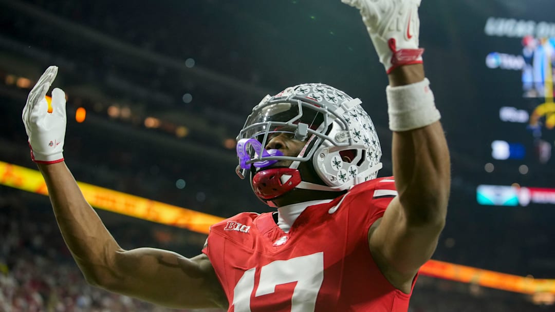 Ohio State Buckeyes wide receiver Carnell Tate (17) celebrates a touchdown Saturday, Dec. 6, 2025, during the Big Ten football championship against the Indiana Hoosiers at Lucas Oil Stadium in Indianapolis.