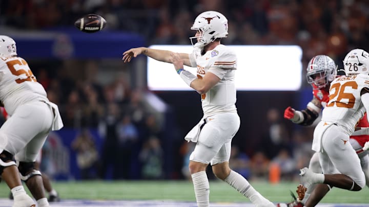 Texas quarterback Quinn Ewers and his offensive linemen broke out into celebration after a game-tying interception in the first half.