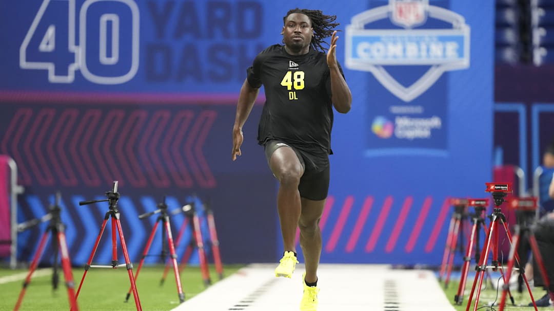Feb 26, 2026; Indianapolis, IN, USA; UCF defensive lineman Malachi Lawrence (DL48) runs the 40-yard dash during the NFL Scouting Combine  at Lucas Oil Stadium. Mandatory Credit: Kirby Lee-Imagn Images