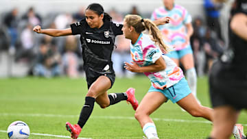 Angel City FC forward Alyssa Thompson (21) moves the ball in front of San Diego Wave FC midfielder Kimmi Ascanio (17) during the second half at BMO Stadium