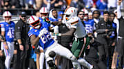 Nov 1, 2025; Dallas, Texas, USA;  Miami Hurricanes linebacker Mohamed Toure (1) breaks up a pass intended for SMU Mustangs tight end RJ Maryland (82) during the game between the Mustangs and the Hurricanes at Gerald J. Ford Stadium. Mandatory Credit: Jerome Miron-Imagn Images