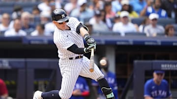 Jun 25, 2023; Bronx, New York, USA; New York Yankees center fielder Harrison Bader (22) hits a double against the Texas Rangers during the sixth inning at Yankee Stadium. Mandatory Credit: Gregory Fisher-Imagn Images