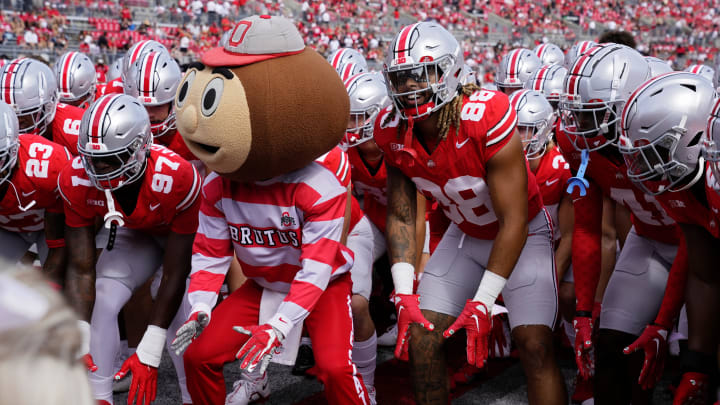 Sept. 9, 2023; Columbus, Oh., USA; 
Brutus Buckeye and Ohio State Buckeyes tight end Gee Scott Jr. (88) take a stance as the Ohio State Buckeyes huddle up before Saturday's NCAA Division I football game against the Youngstown State Penguins at Ohio Stadium.