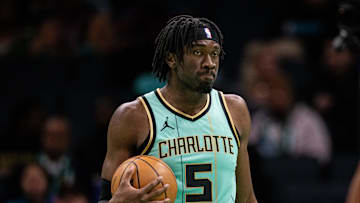 Jan 24, 2025; Charlotte, North Carolina, USA; Charlotte Hornets center Mark Williams (5) holds the ball against the Portland Trail Blazers during the second quarter at Spectrum Center. Mandatory Credit: Scott Kinser-Imagn Images