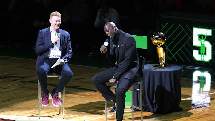 Mar 13, 2022; Boston, Massachusetts, USA; Basketball Hall of Fame and former Boston Celtic, Kevin Garnett speaks with Brian Scalabrine during the number retirement ceremony after the game between the Boston Celtics the Dallas Mavericks at TD Garden. Mandatory Credit: Gregory Fisher-Imagn Images