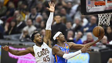 Oct 27, 2023; Cleveland, Ohio, USA; Oklahoma City Thunder guard Shai Gilgeous-Alexander (2) moves to the basket against Cleveland Cavaliers guard Donovan Mitchell (45) in the second quarter at Rocket Mortgage FieldHouse. Mandatory Credit: David Richard-Imagn Images