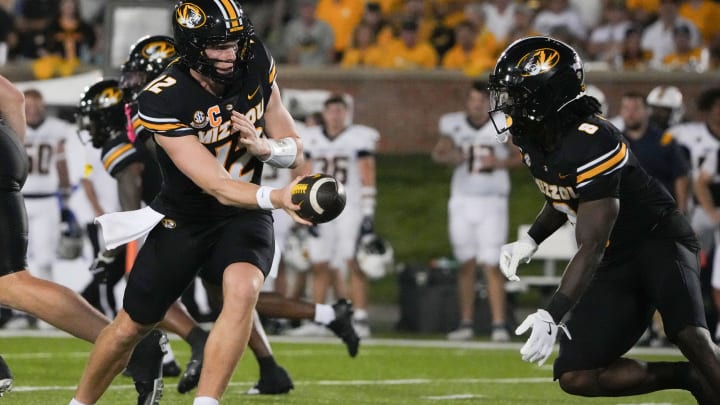 Aug 29, 2024; Columbia, Missouri, USA; Missouri Tigers quarterback Brady Cook (12) hands off to running back Nate Noel (8) against the Murray State Racers during the first half at Faurot Field at Memorial Stadium. Mandatory Credit: Denny Medley-USA TODAY Sports