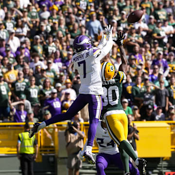  Minnesota Vikings cornerback Byron Murphy Jr. (7) breaks up the  pass intended for Green Bay Packers wide receiver Bo Melton.