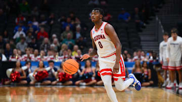 Mar 21, 2025; Seattle, WA, USA; Arizona Wildcats guard Jaden Bradley (0) dribbles the ball against the Akron Zips during the first half in the first round of the NCAA Tournament at Climate Pledge Arena. Mandatory Credit: Steven Bisig-Imagn Images