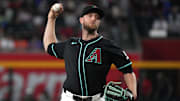 May 7, 2025; Phoenix, Arizona, USA; Arizona Diamondbacks pitcher Merrill Kelly (29) throws against the New York Mets in the first inning at Chase Field. Mandatory Credit: Rick Scuteri-Imagn Images
