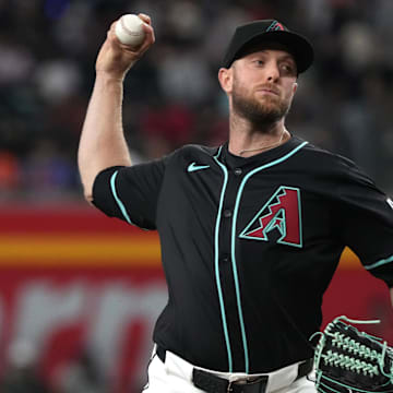 May 7, 2025; Phoenix, Arizona, USA; Arizona Diamondbacks pitcher Merrill Kelly (29) throws against the New York Mets in the first inning at Chase Field. Mandatory Credit: Rick Scuteri-Imagn Images