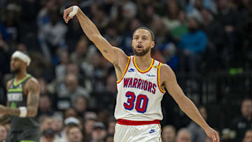 Jan 15, 2025; Minneapolis, Minnesota, USA; Golden State Warriors guard Stephen Curry (30) celebrates after making a three point shot against the Minnesota Timberwolves in the first half at Target Center. Mandatory Credit: Jesse Johnson-Imagn Images