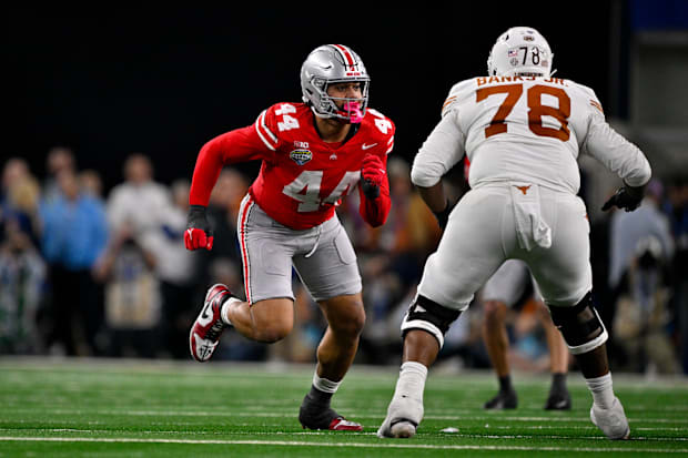 Ohio State Buckeyes defensive end JT Tuimoloau and Texas Longhorns offensive lineman Kelvin Banks Jr. Ohio State Buckeyes defensive end JT Tuimoloau and Texas Longhorns offensive lineman Kelvin Banks Jr.