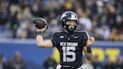 Oct 25, 2025; Morgantown, West Virginia, USA; West Virginia Mountaineers quarterback Scotty Fox Jr. (15) throws a pass during the first quarter against the Texas Christian University Horned Frogs at Milan Puskar Stadium. Mandatory Credit: Ben Queen-Imagn Images