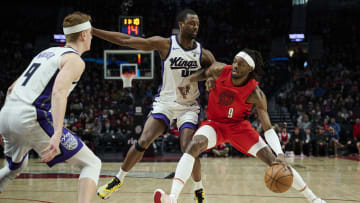 Dec 26, 2023; Portland, Oregon, USA; Portland Trail Blazers forward Jerami Grant (9) dribbles the basketball during the first half against Sacramento Kings forward Harrison Barnes (40) at Moda Center. Mandatory Credit: Troy Wayrynen-USA TODAY Sports