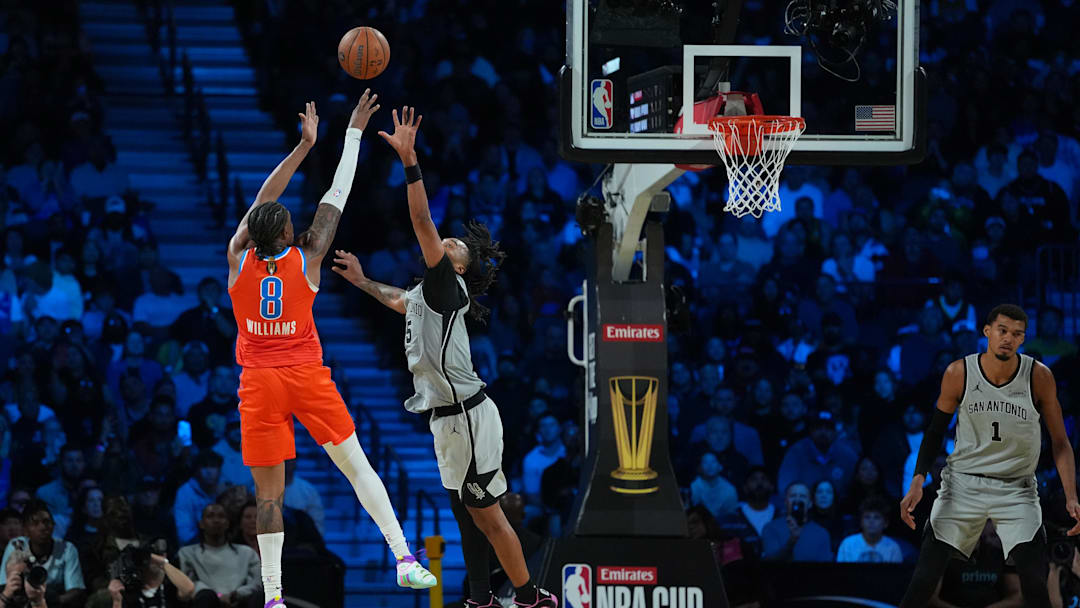 Dec 13, 2025; Las Vegas, Nevada, USA; Oklahoma City Thunder guard Jalen Williams (8) shoots over San Antonio Spurs guard Stephon Castle (5) during the fourth quarter at T-Mobile Arena. Mandatory Credit: Kirby Lee-Imagn Images