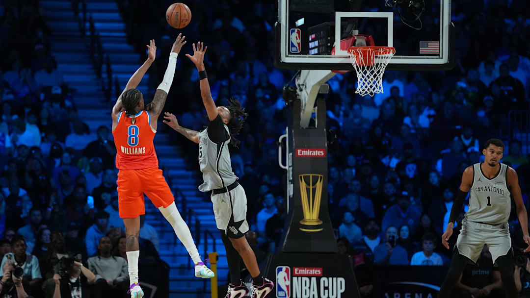 Dec 13, 2025; Las Vegas, Nevada, USA; Oklahoma City Thunder guard Jalen Williams (8) shoots over San Antonio Spurs guard Stephon Castle (5) during the fourth quarter at T-Mobile Arena. Mandatory Credit: Kirby Lee-Imagn Images