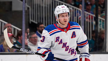 Mar 29, 2025; San Jose, California, USA; New York Rangers defenseman Adam Fox (23) skates against the San Jose Sharks during the second period at SAP Center at San Jose. Mandatory Credit: Robert Edwards-Imagn Images