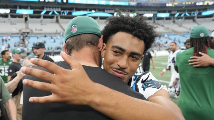 Aug 12, 2023; Charlotte, North Carolina, USA; Carolina Panthers quarterback Bryce Young (9) with New York Jets quarterback Aaron Rodgers (8) after the game at Bank of America Stadium.