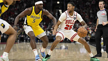 Mar 10, 2025; Chicago, Illinois, USA; Chicago Bulls forward Dalen Terry (25) dribbles against Indiana Pacers forward Jarace Walker (5) during the second half  at United Center. Mandatory Credit: Matt Marton-Imagn Images