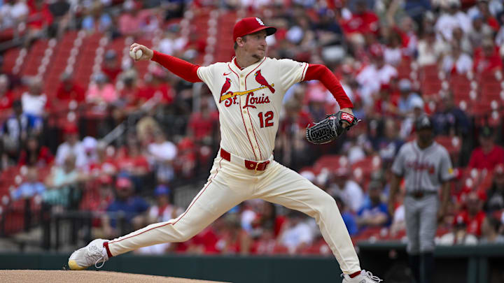 Jul 12, 2025; St. Louis, Missouri, USA;  St. Louis Cardinals starting pitcher Erick Fedde (12) pitches against the Atlanta Braves during the first inning at Busch Stadium. Mandatory Credit: Jeff Curry-Imagn Images