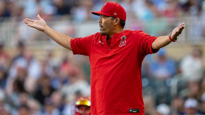 Jul 10, 2026; Minneapolis, Minnesota, USA; Los Angeles Angels head coach Kurt Suzuki throws his arms up towards home plate umpire Chris Segal (not pictured) agaisnt the Minnesota Twins in the first inning at Target Field. Mandatory Credit: Jesse Johnson-Imagn Images